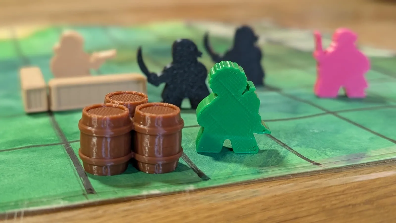 Three barrels on a board square, a green courier figure beside them, two dark enemies out of focus behind